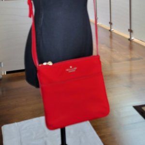 Red nylon authentic Kate Spade crossbody with leather strap